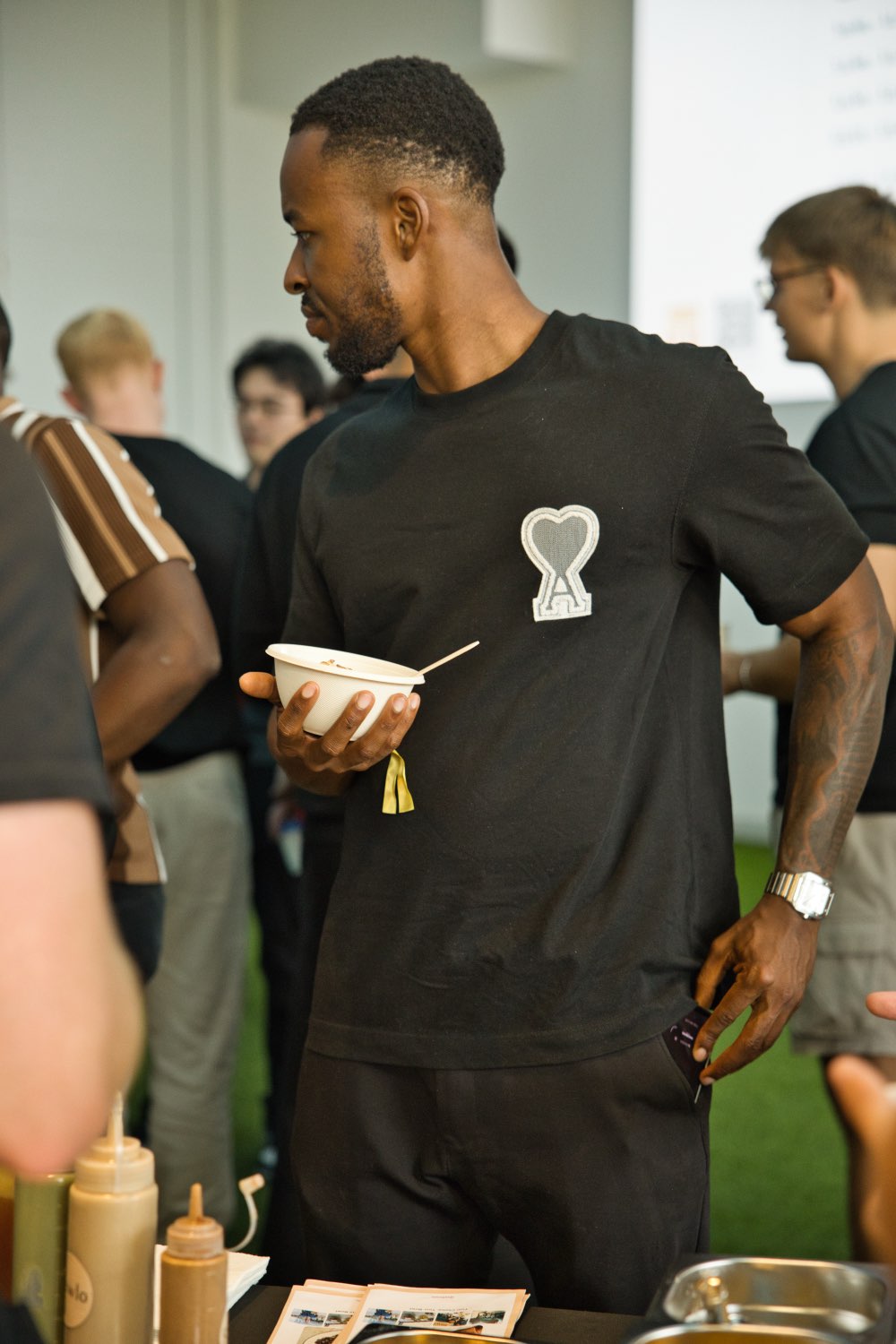 A guest with their bowl at a corporate event