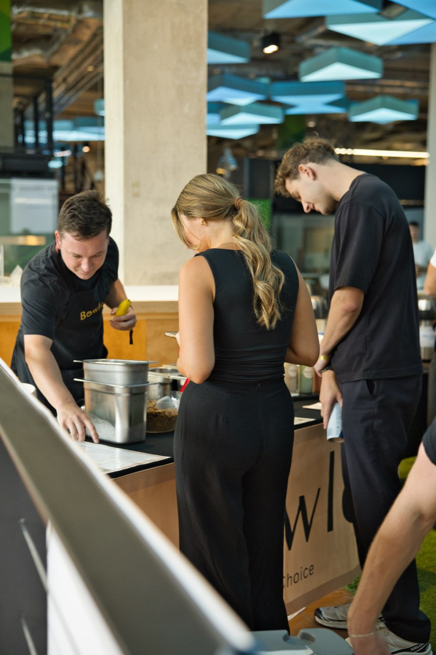 Serving bowls across the counter at an office