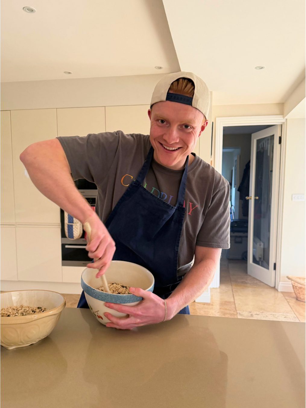 Ollie mixing a batch of granola by hand