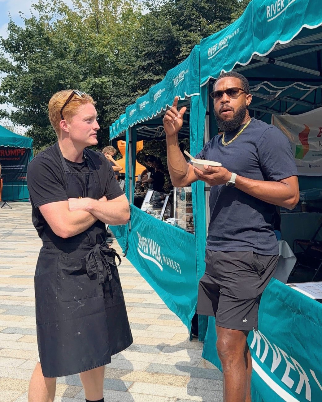 Talking to a customer outside the stall