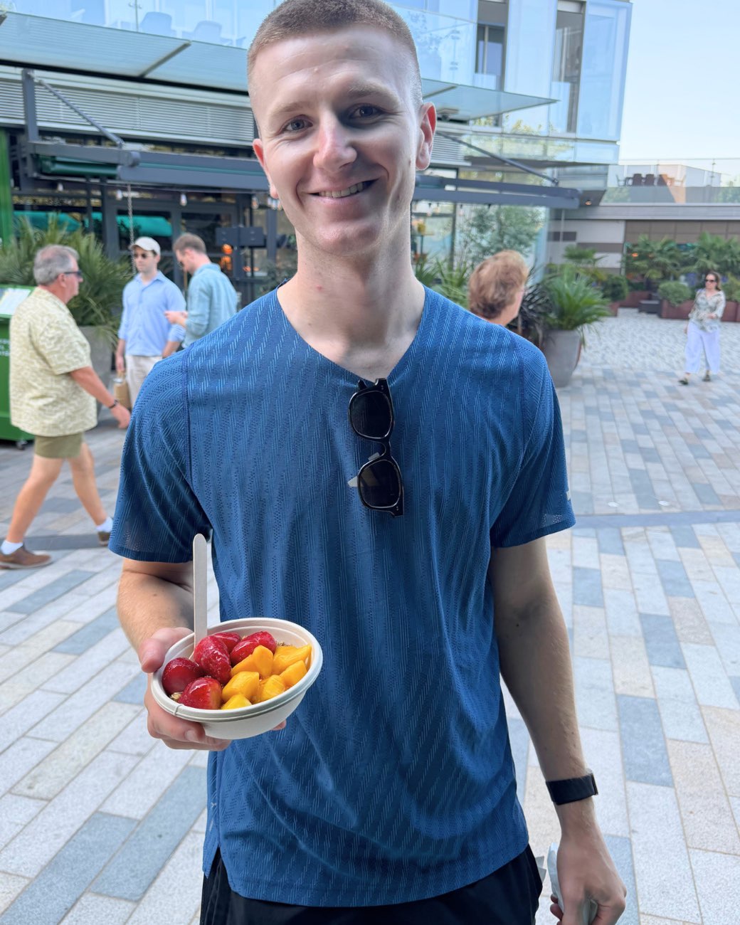 A customer with his bowl outside the market