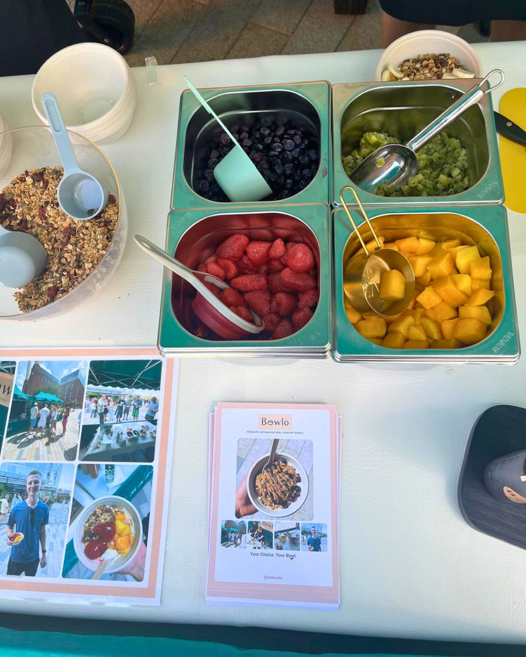 Trays of fruit and granola laid out on the stall