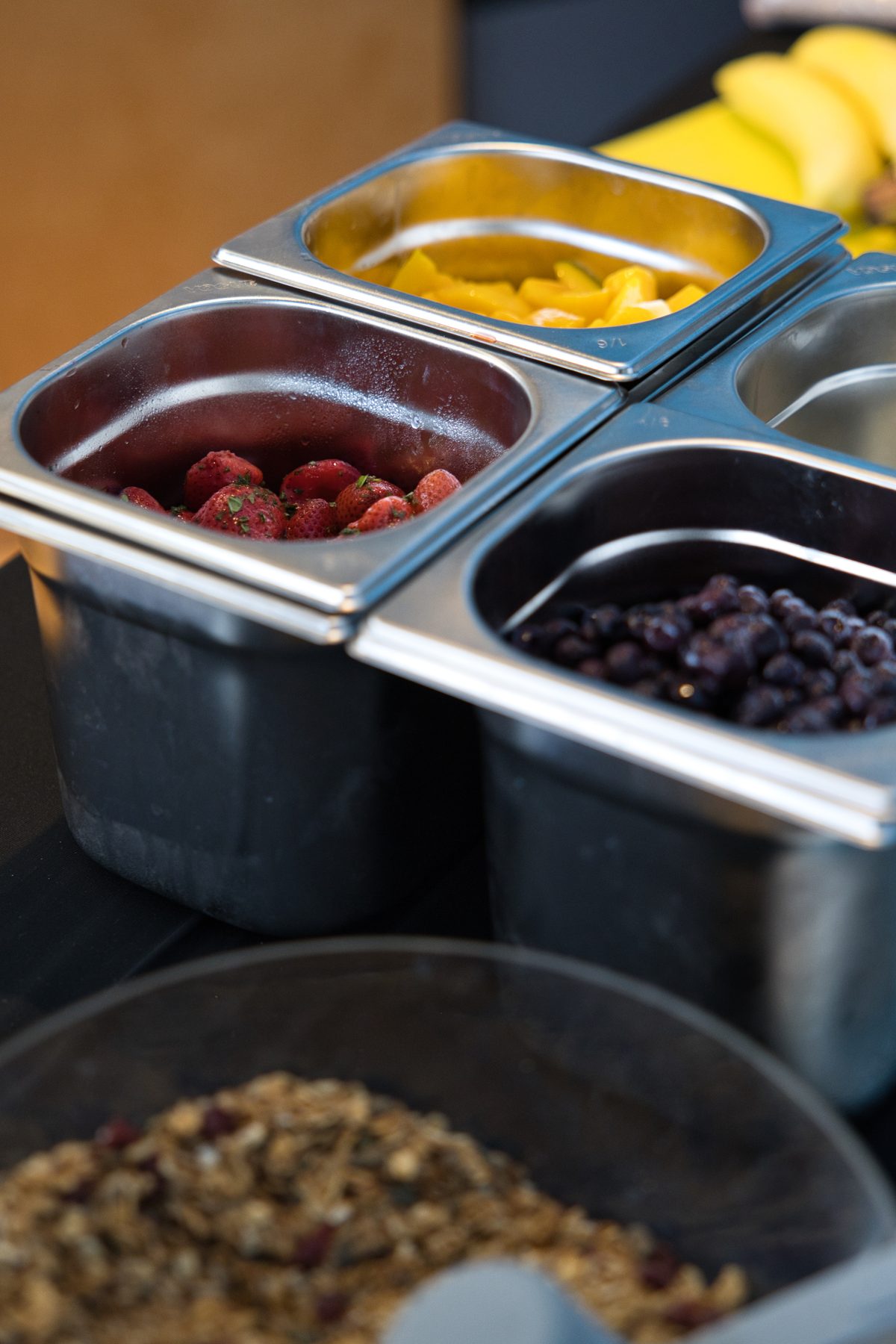 Trays of mango, berries and granola on the Bowlo stall