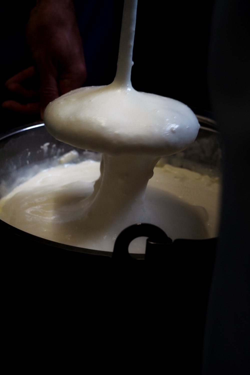 Yoghurt pouring from the vat at the dairy